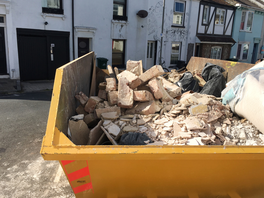 Hire a skip - skip on driveway with debris