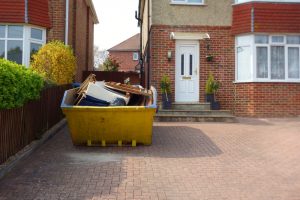Skip bin filled with household waste via skip hire Birmingham service